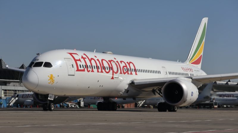 a large white airplane with red writing on it