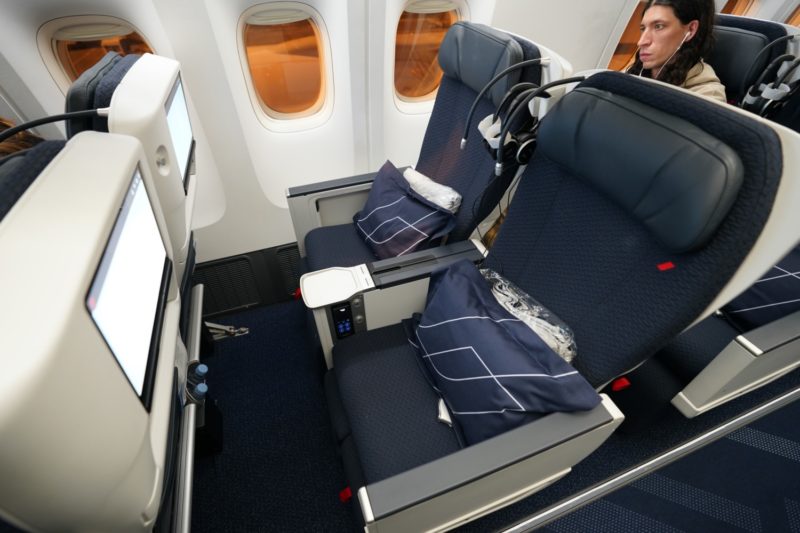 a man sitting in an airplane seat