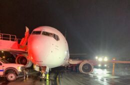 a plane on the runway at night