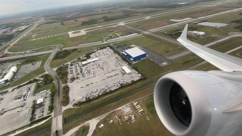 an airplane wing and engine of an airplane