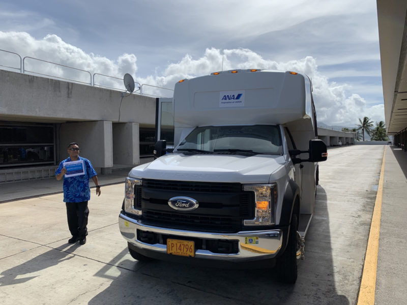 a man standing next to a truck