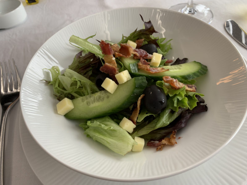 a salad in a white bowl