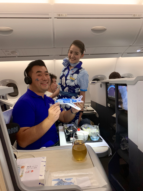 a man holding a toy airplane