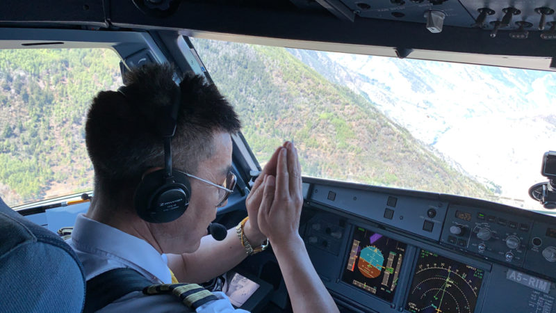 a man in a pilot's cockpit