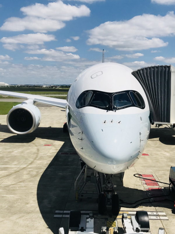 a white airplane on a tarmac