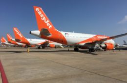 a group of airplanes on a runway