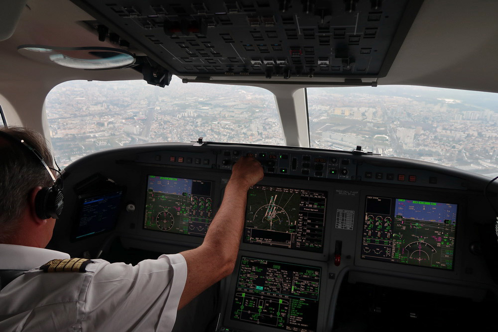 a person in a cockpit of an airplane