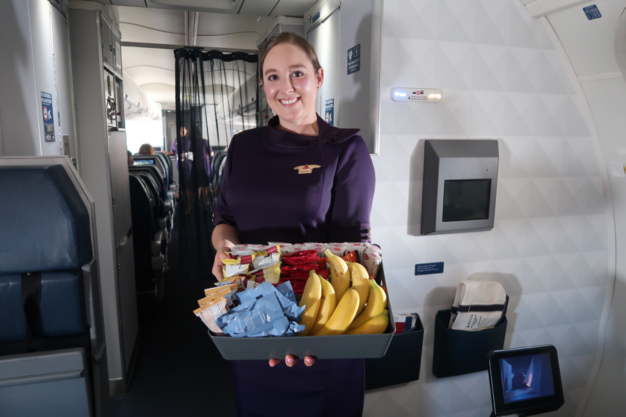 a woman holding a tray of food