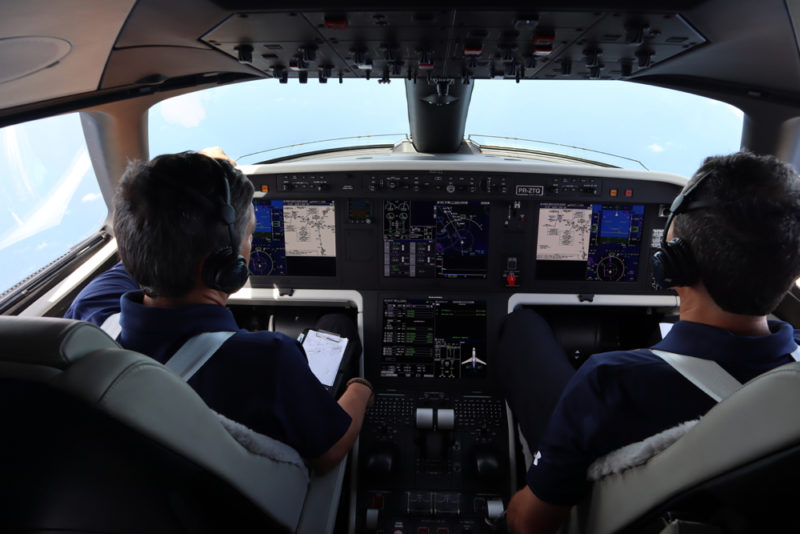 people in the cockpit of an airplane