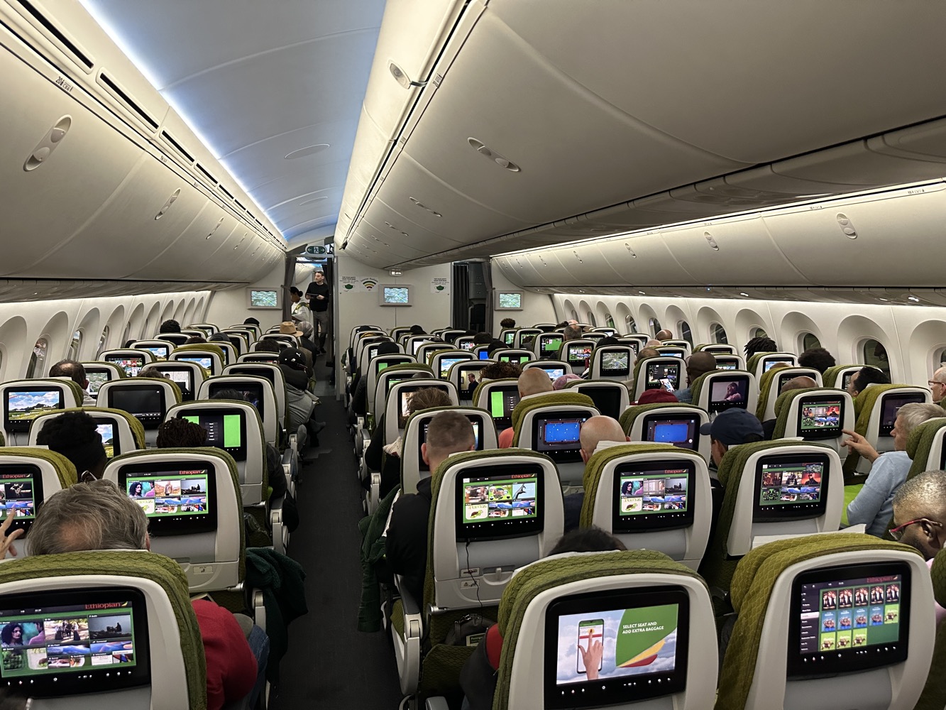 a group of people sitting in an airplane