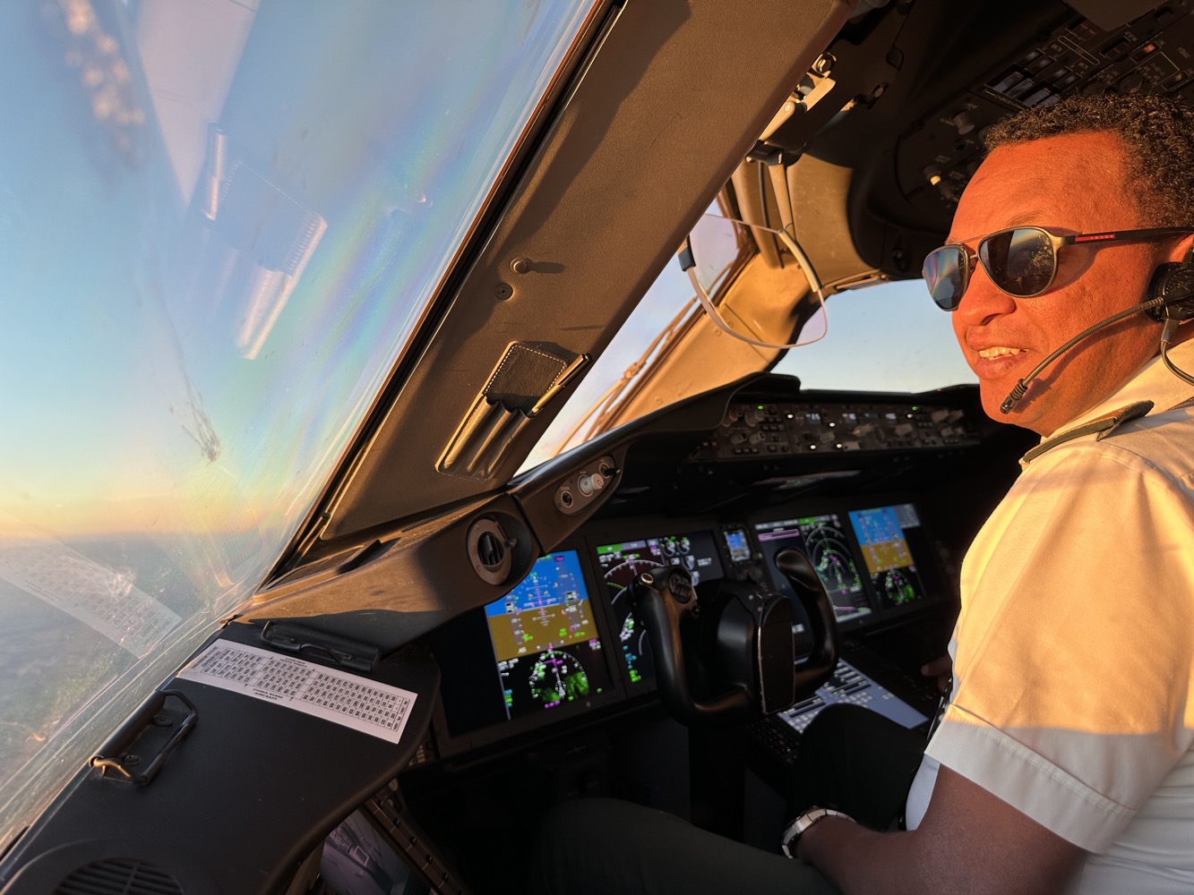 a man in a cockpit of an airplane