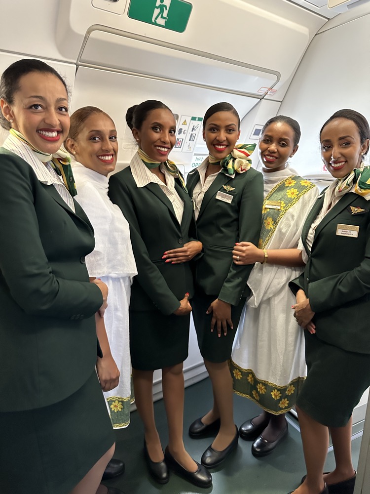 a group of women wearing green uniforms