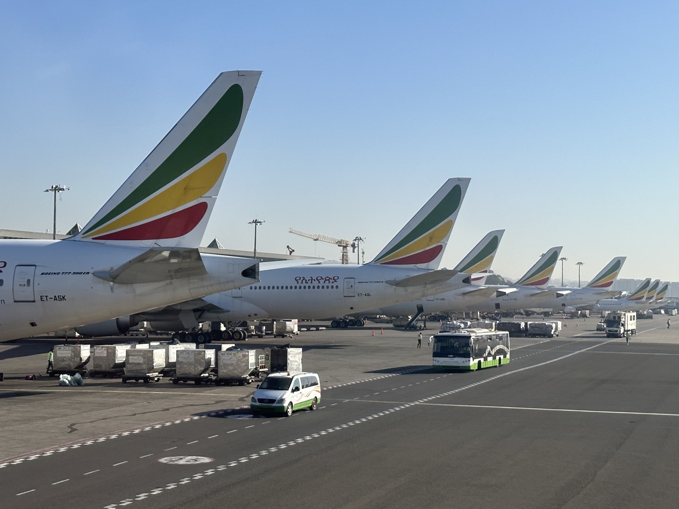 a group of airplanes parked on a runway