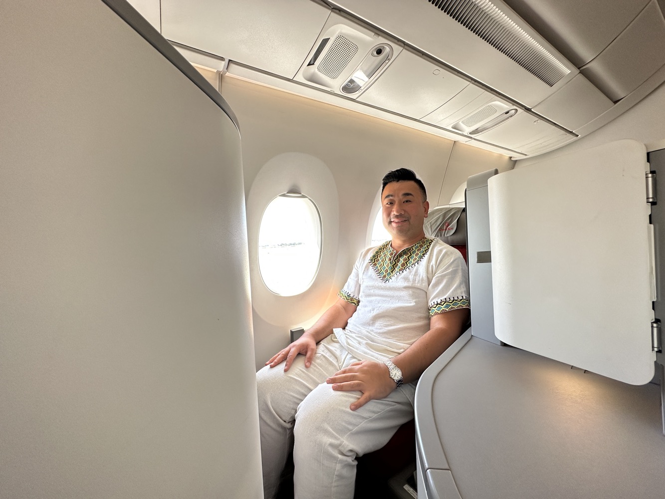 a man sitting in an airplane