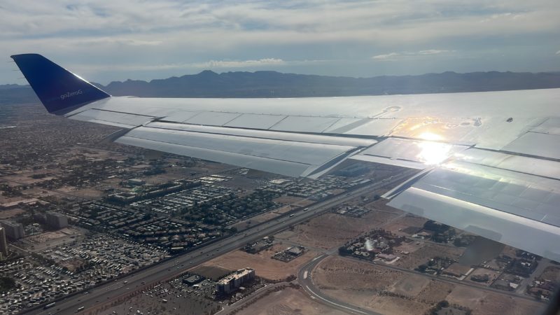 an airplane wing in the sky