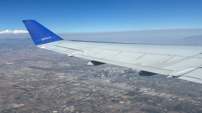 an airplane wing in the sky