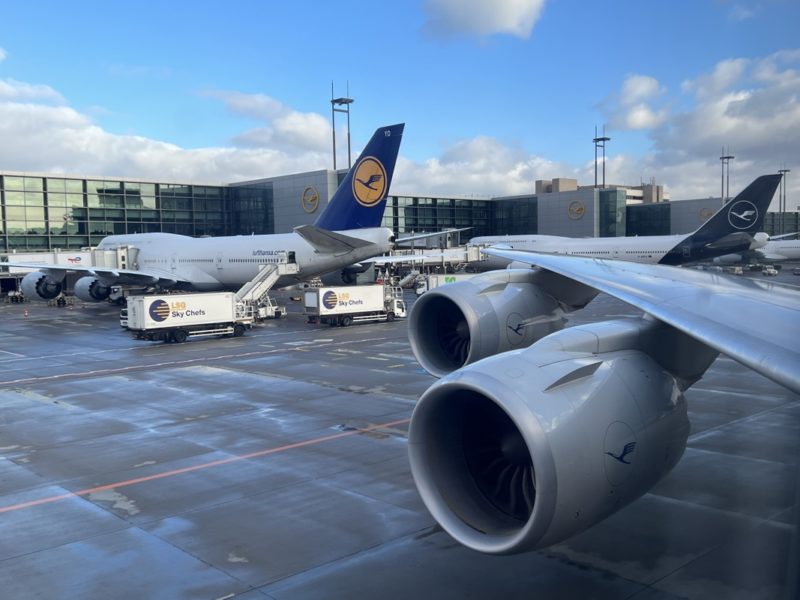 a group of airplanes at an airport