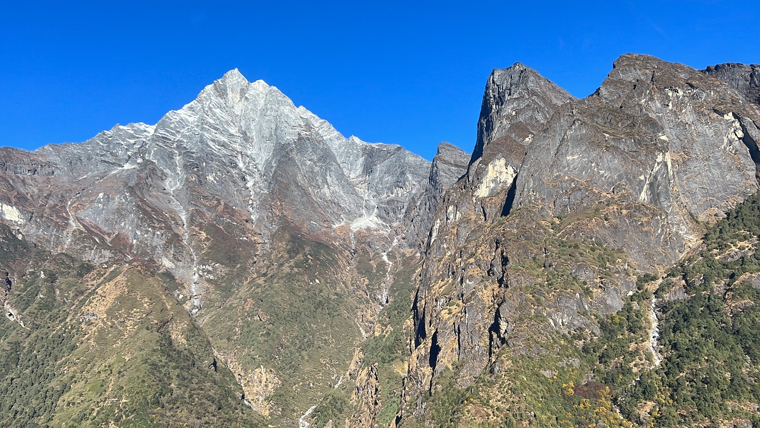 a mountain range with a blue sky