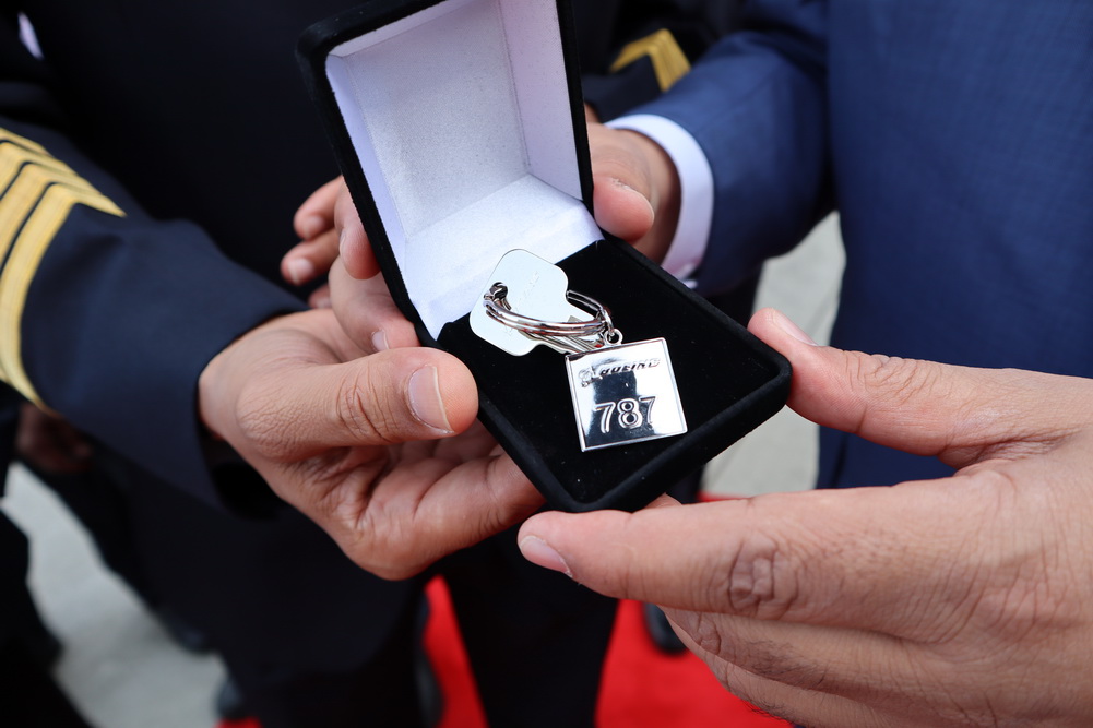 a person holding a box with a key chain