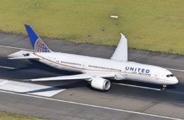 a white airplane on a runway