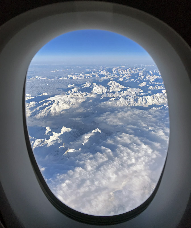 a view of the mountains from an airplane window