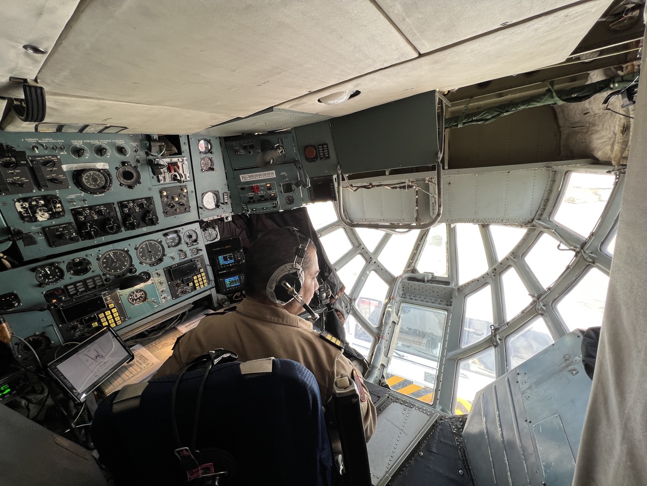 a man in a pilot's cockpit