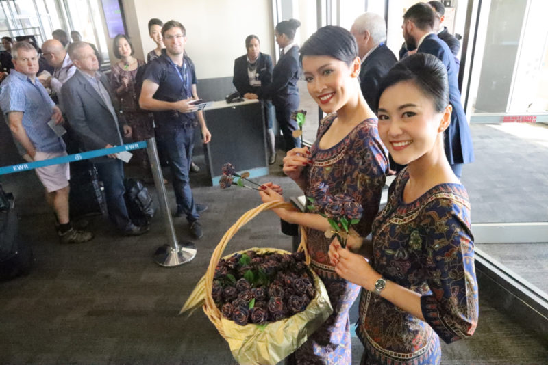 a group of women holding flowers