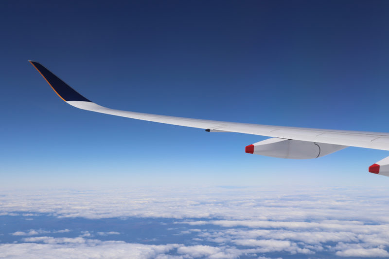 the wing of an airplane in the sky