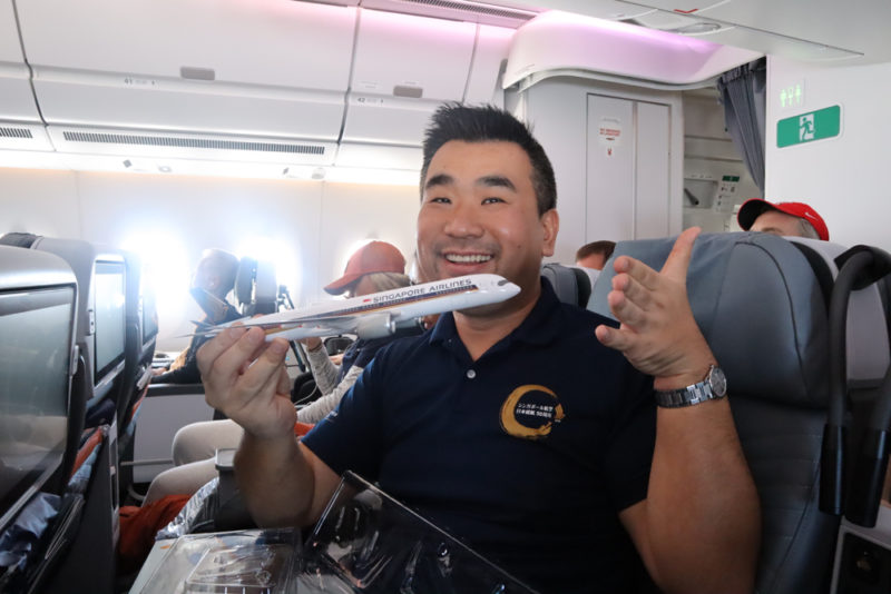 a man holding a model airplane