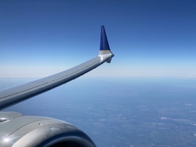 an airplane wing in the sky