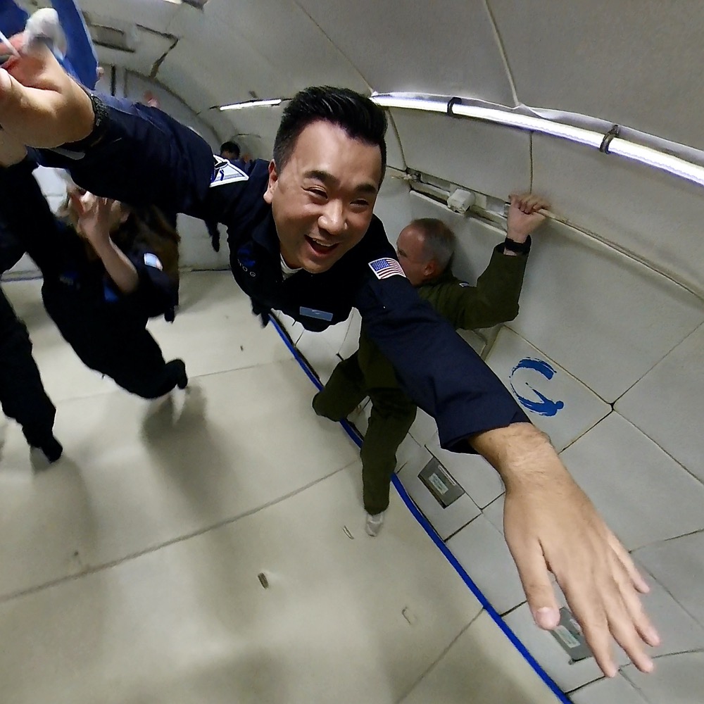 a man in a uniform flying through a tunnel