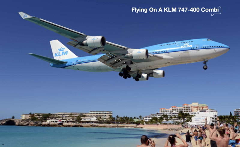 a plane flying over a beach