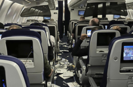 a group of people sitting on an airplane